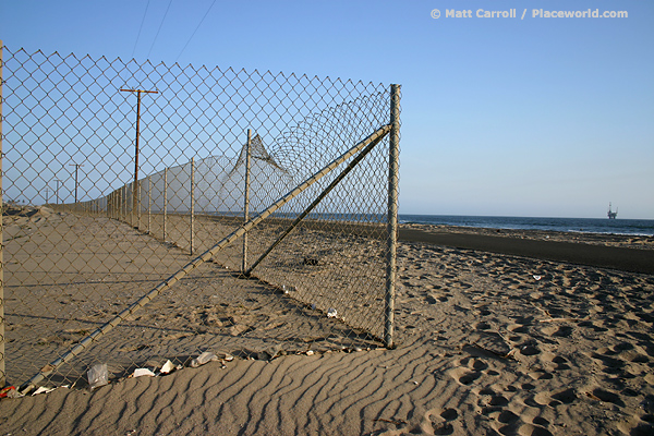 chain link fence on beach related to the Bolsa Chica Lowlands Restoration Project