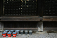 Fire Buckets Next to Wooden Temple