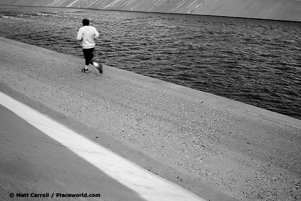 runner along a river