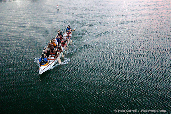 15 people paddling a dragon boat through Alamitos Bay - photographer Matt Carroll